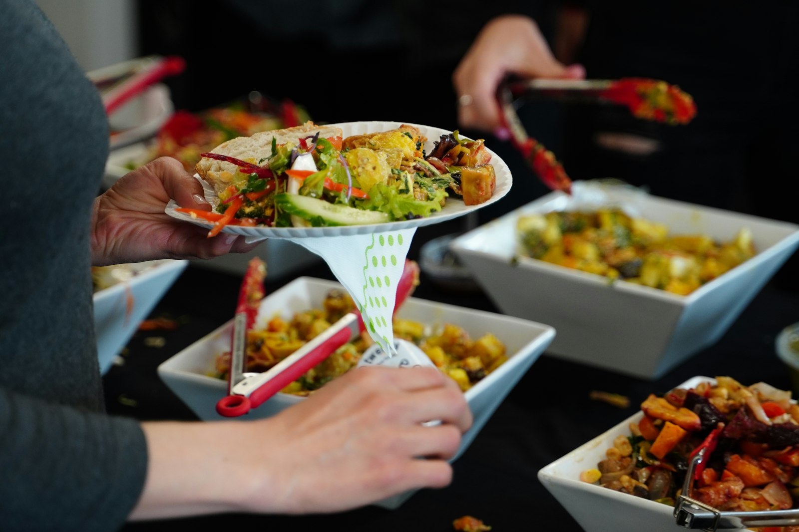 Guests serving themselves from catering trays